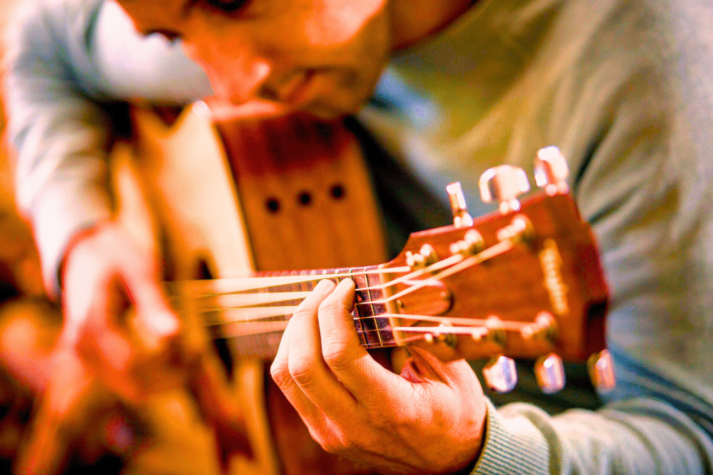 The guitarist plays the guitar.