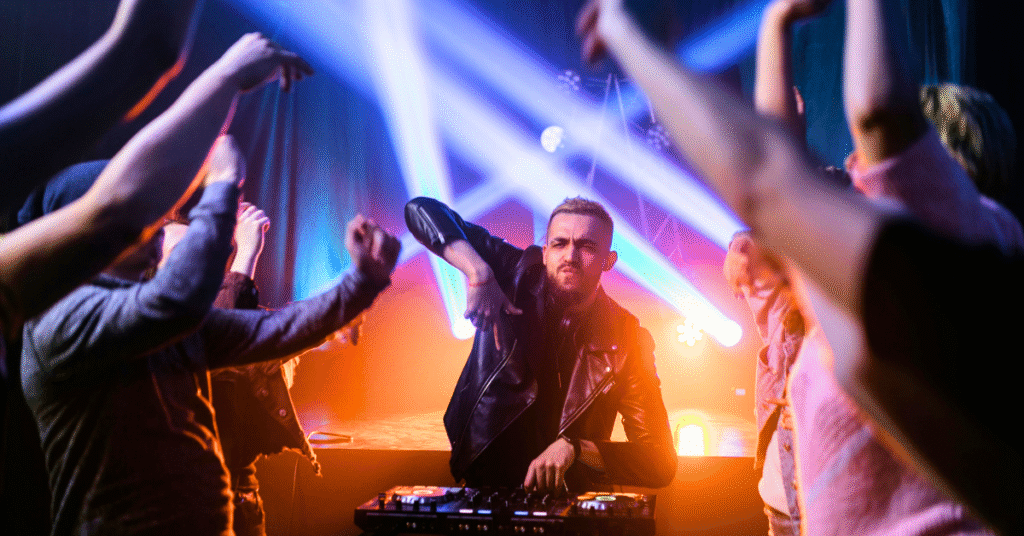 Wedding DJ performing with crowd dancing